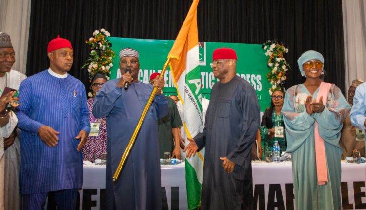 Atiku Abubakar hodls ADC flag after winning presidential primary elections in 2026.